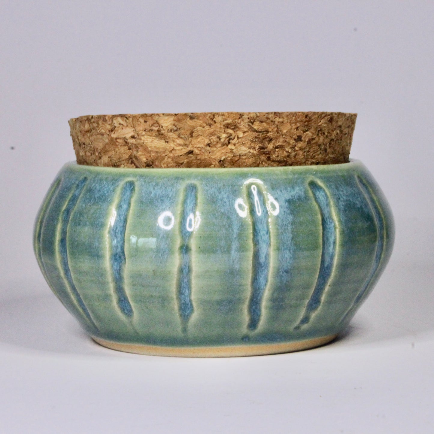 Voorraadpotje strepen turquoise met bondel